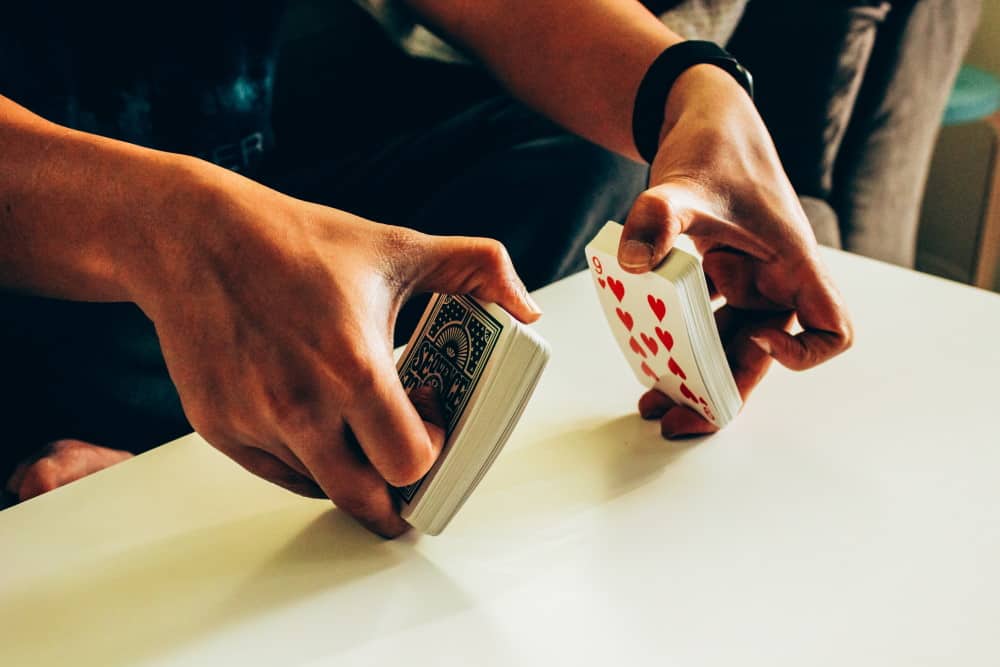 Solo shuffling: Dealing cards and stacking piles, students turn to  solitaire to pass time – U-High Midway